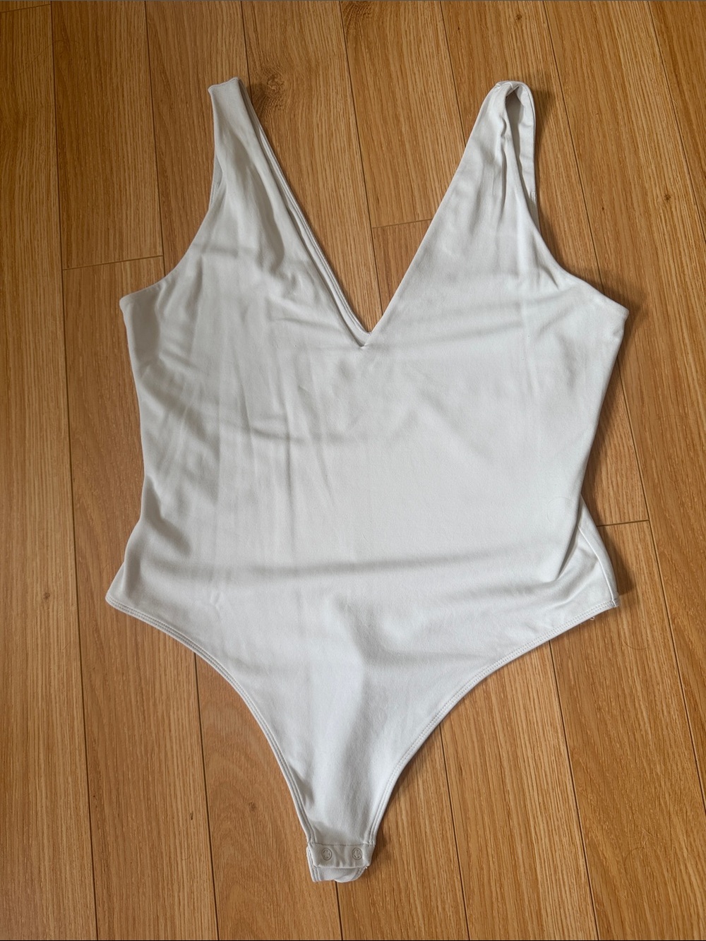 Babaton White V-Neck One-Piece Bodysuit